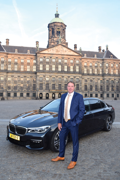 Bart van Leijden and one of ETS’s BMWs in front of The Royal Palace of Amsterdam
