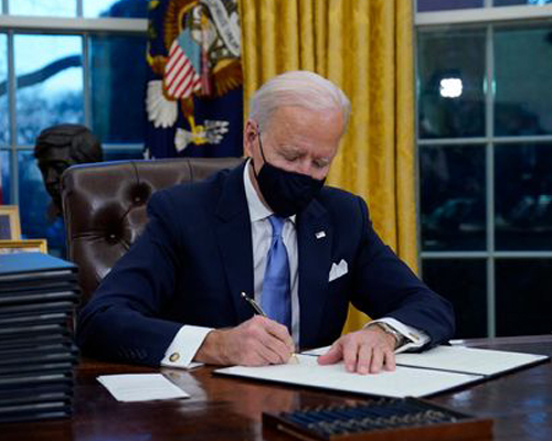 President Joe Biden signs mask mandate